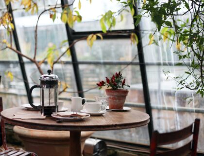 Coffee press on a table by the window