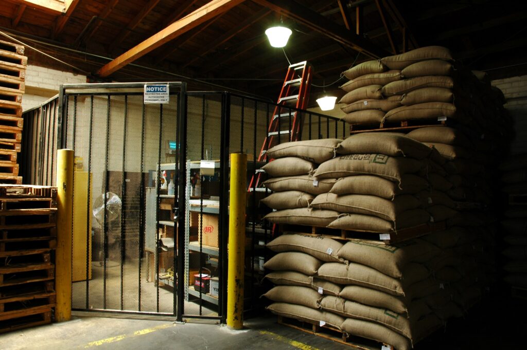 Coffee processor and manufacturing storage of coffee beans arriving from tropical locations