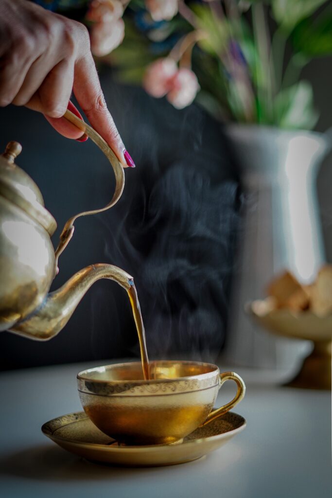 coffee being poured into gold cup