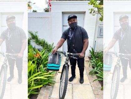 Jack Umba delivering coffee on a bicycle