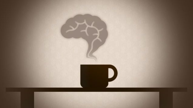 a cup of coffee with the shadow of a brain as smoke